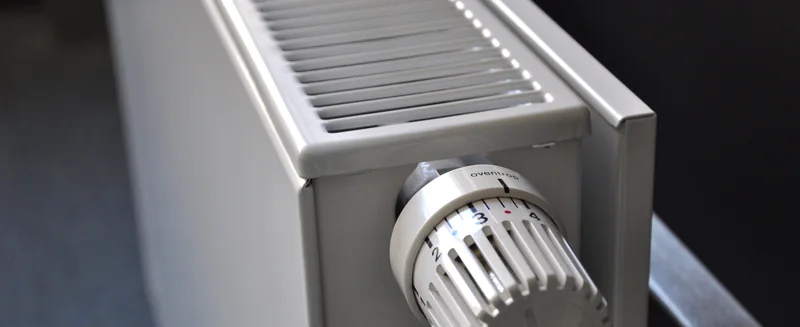 A panel radiator fitted with a thermostatic radiator valve.